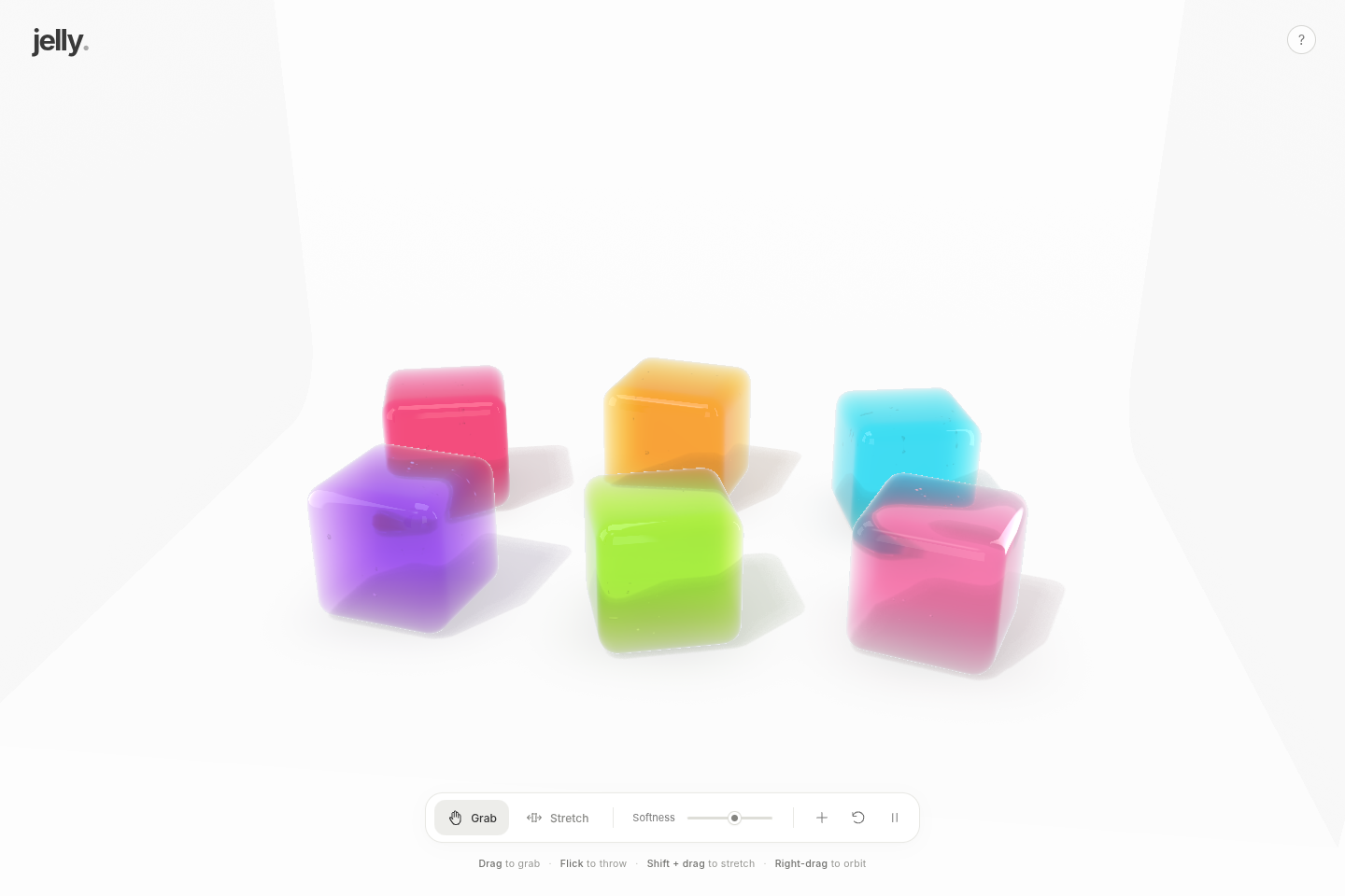Six colourful translucent jelly blocks arranged in a bright white studio